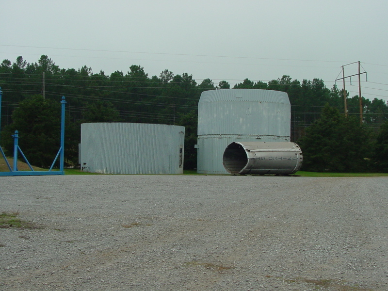 S-IC intertank, S-II forward skirts, and Gemini-Titan 5 recovered stage in the U.S. Space and Rocket Center Bone Yard
