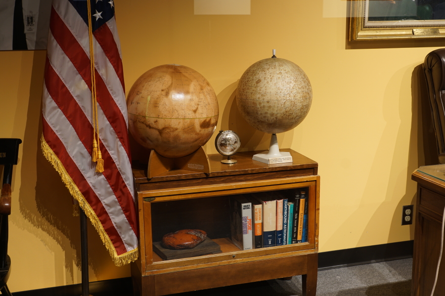 Book shelf in von Braun's ABMA Office (Rocket City Legacy) with Mars and lunar globes at U.S. Space and Rocket Center
