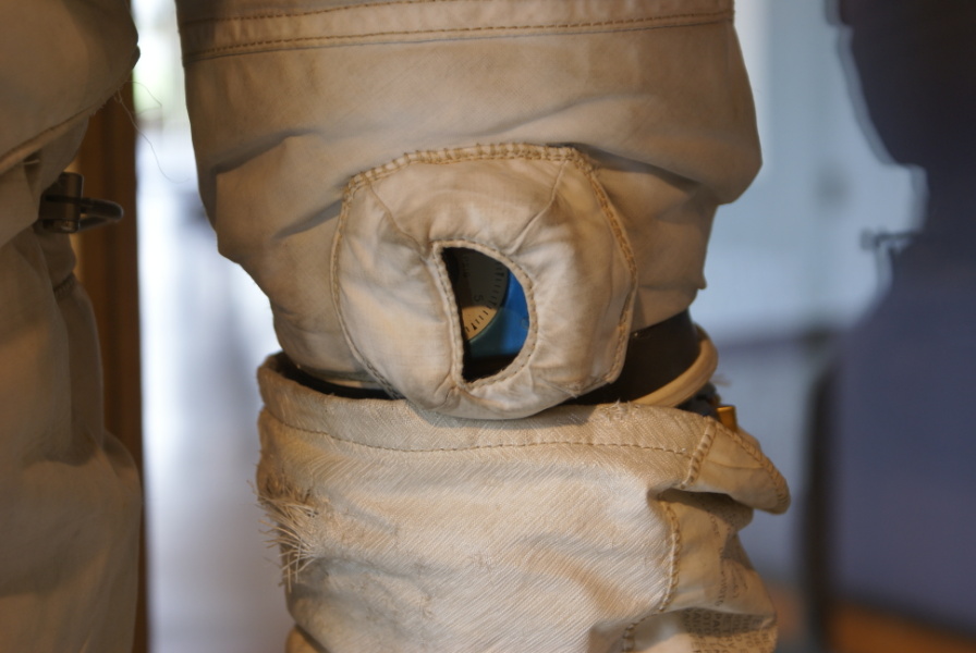 Schweickart's Skylab Training Suit wrist ring and pressure gauge at Wallops Island